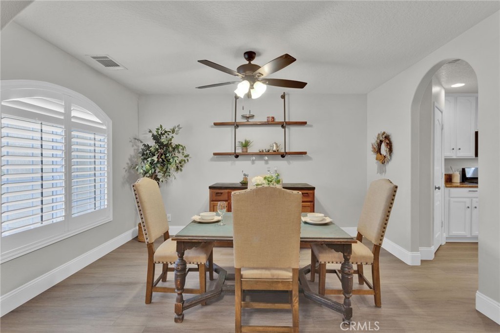 11410 Cibola Road Apple Valley, CA 92308 - Photo 9 of 45 a dining room with furniture and window