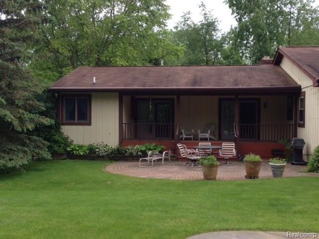 2198 West Barron Road Howell, MI 48855 - Photo 21 of 25 covered porch and brick paver patio