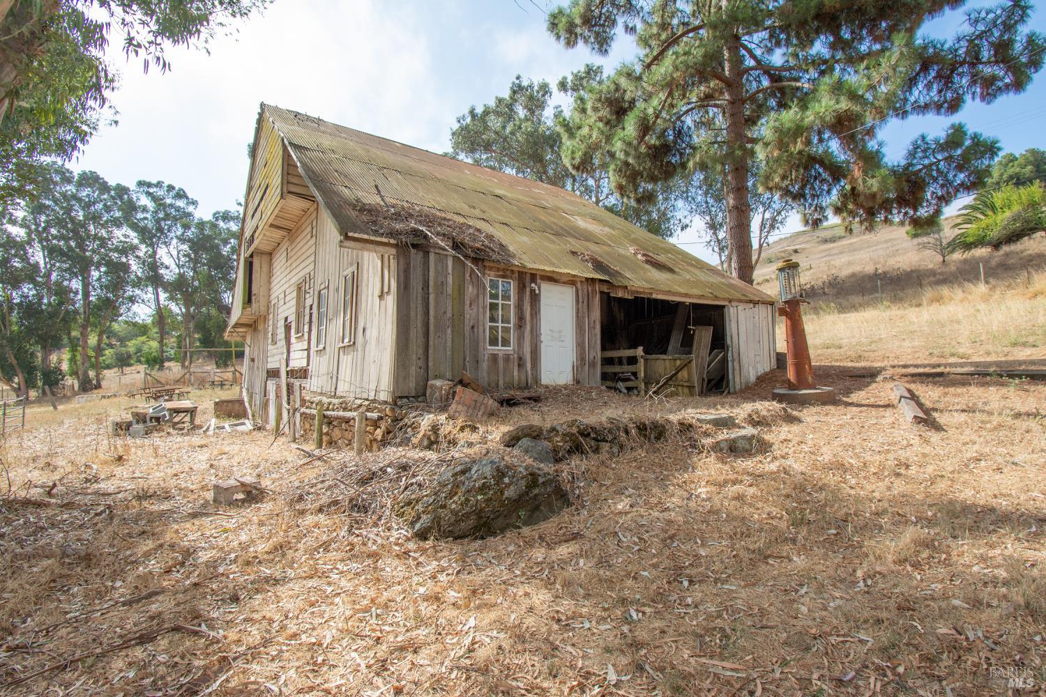 1 St Johns Mine Road Vallejo, CA 94591 - Photo 21 of 40 a backyard of a house with barbeque oven and outdoor seating