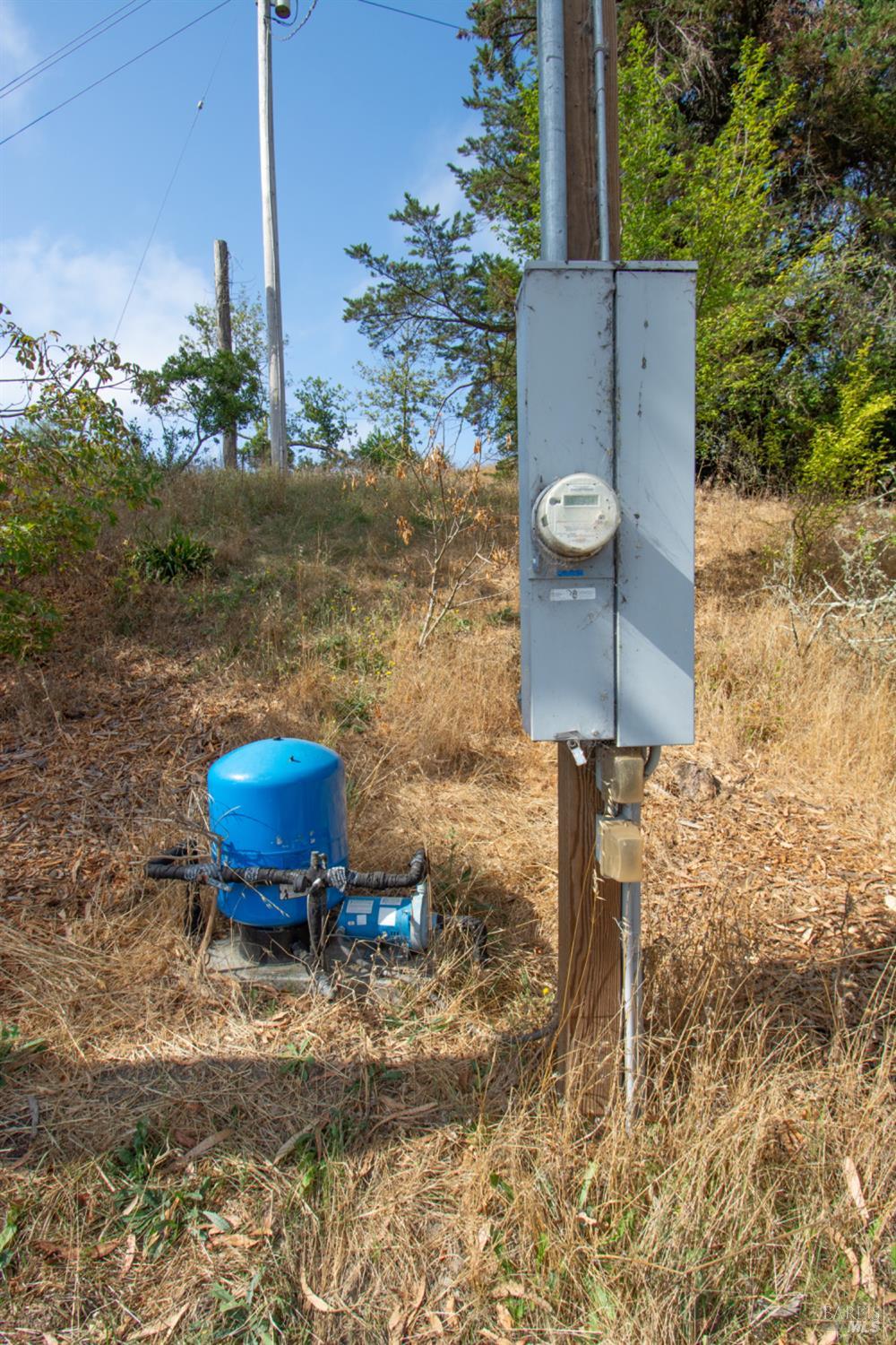 1 St Johns Mine Road Vallejo, CA 94591 - Photo 34 of 40 a view of a backyard with table and chairs plants and wooden fence
