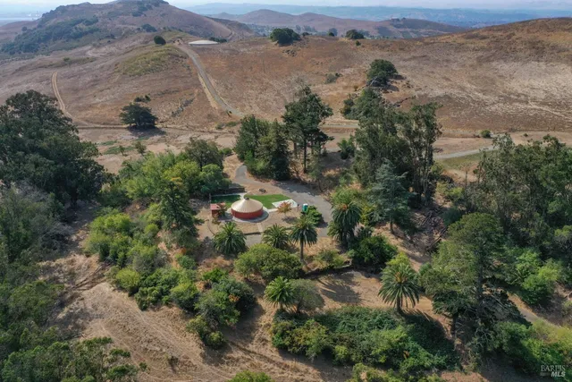 an aerial view of a houses with outdoor space