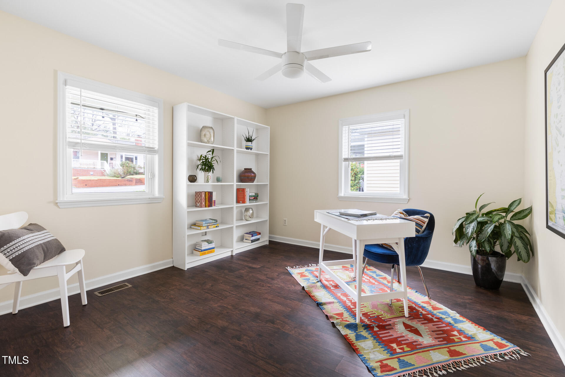 1234 Berkeley Street Durham, NC 27705 - Photo 18 of 46 a living room with furniture and a dining table with bookshelf