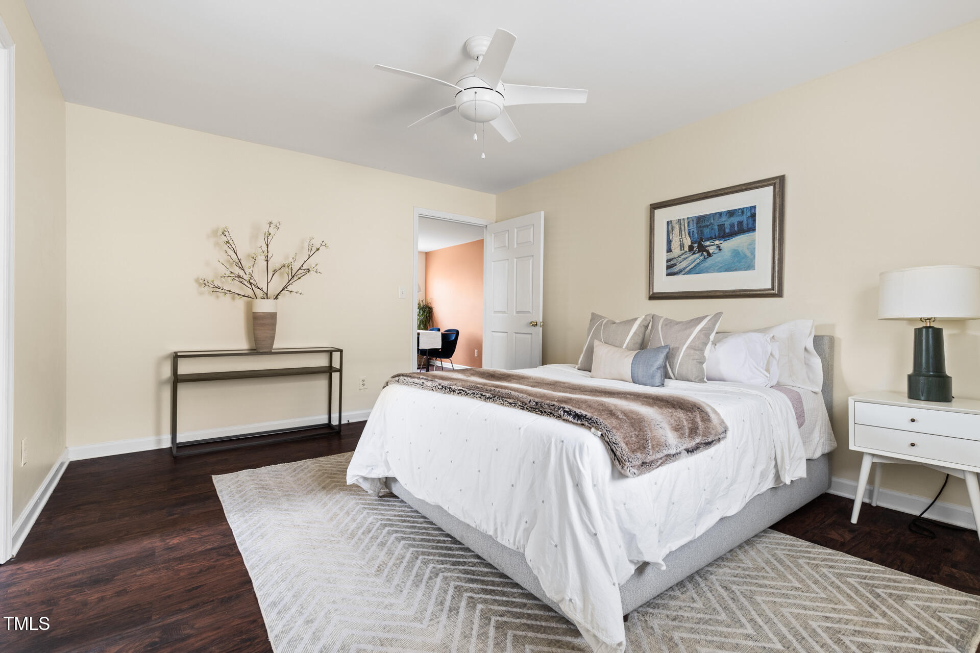 1234 Berkeley Street Durham, NC 27705 - Photo 36 of 46 a bedroom with a large bed and a lamp