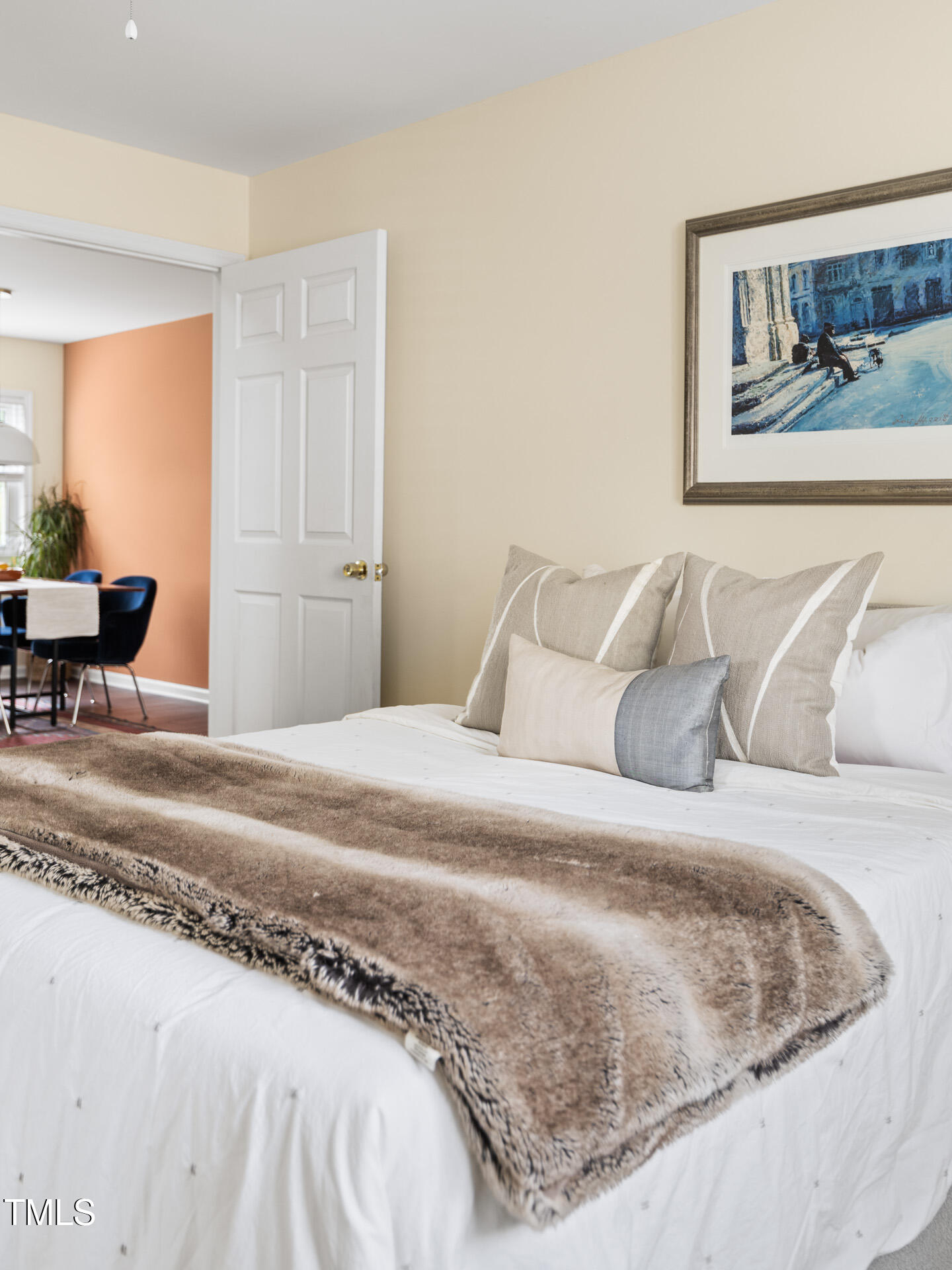 1234 Berkeley Street Durham, NC 27705 - Photo 37 of 46 a bedroom with a bed and a painting on the wall