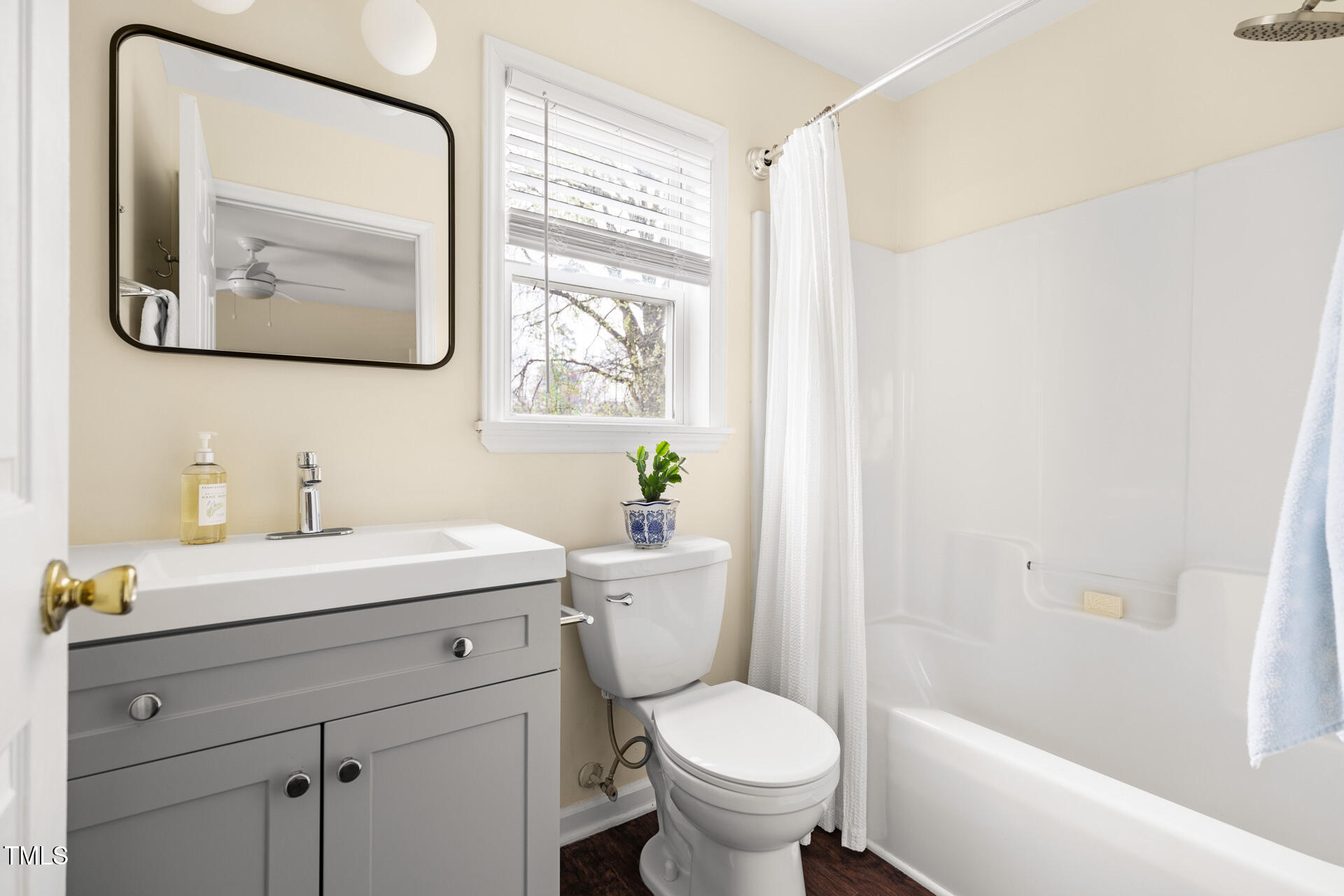 1234 Berkeley Street Durham, NC 27705 - Photo 39 of 46 a bathroom with a toilet a sink and a mirror