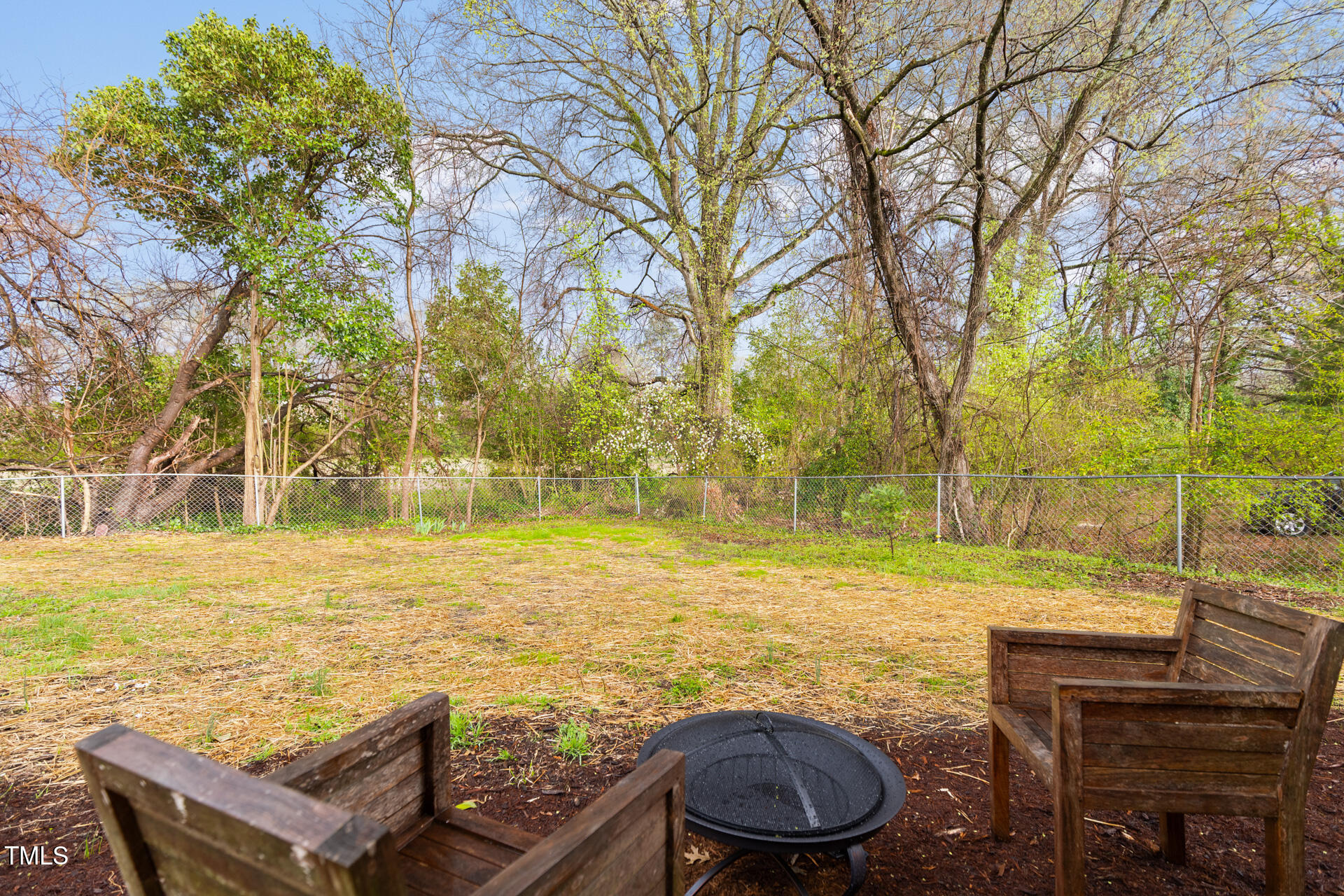1234 Berkeley Street Durham, NC 27705 - Photo 45 of 46 a view of a backyard with lawn chairs under an umbrella