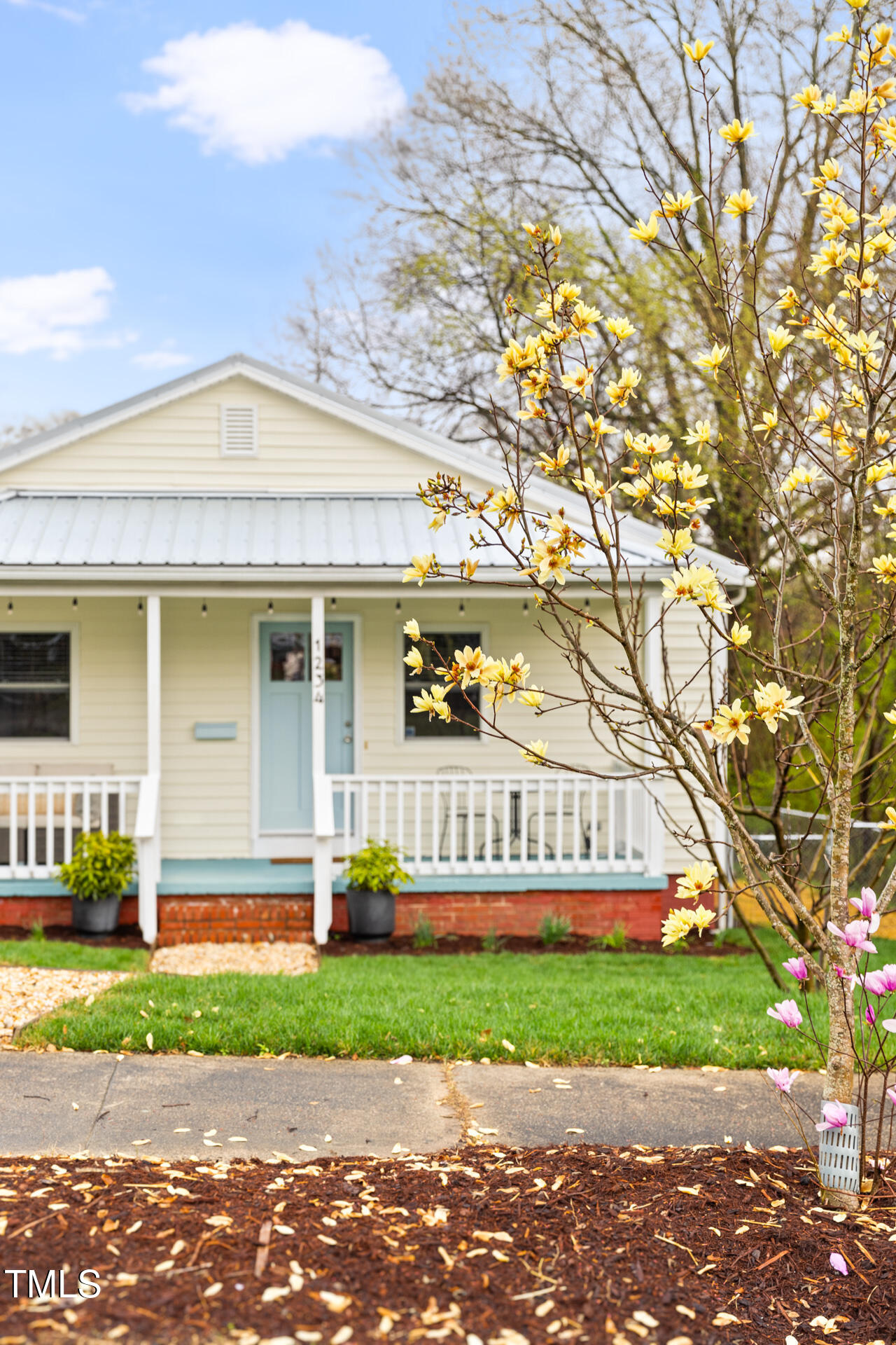 1234 Berkeley Street Durham, NC 27705 - Photo 7 of 46 a front view of a house with a garden and deck