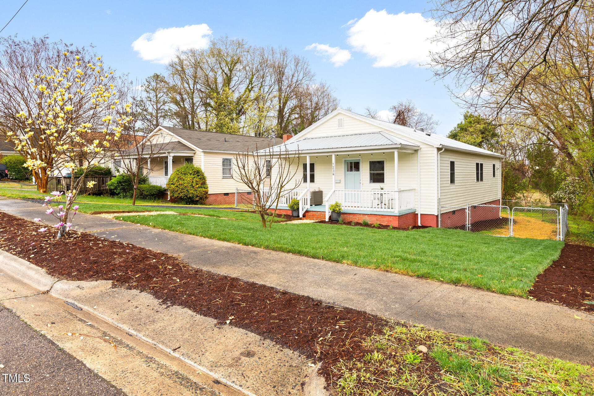 1234 Berkeley Street Durham, NC 27705 - Photo 8 of 46 a front view of a house with a garden and trees