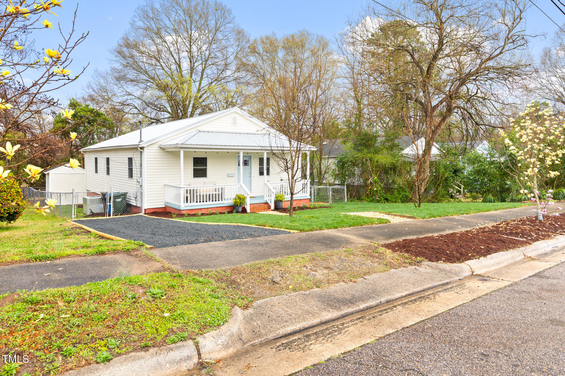 1234 Berkeley Street Durham, NC 27705 - Photo 9 of 46 a front view of a house with garden