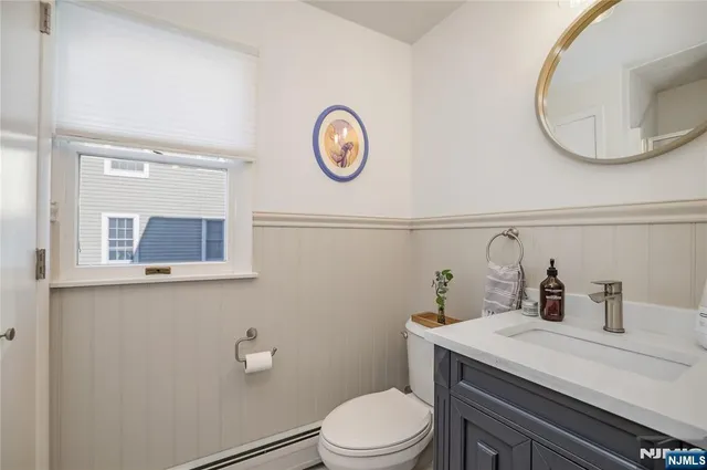 a bathroom with a toilet and a sink