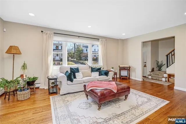 a bedroom with furniture and wooden floor