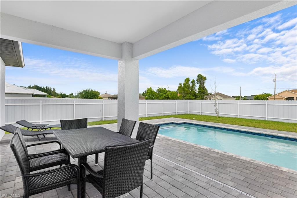 110 Nelson Road South Cape Coral, FL 33991 - Photo 24 of 27 a view of a dining room with furniture and wooden floor