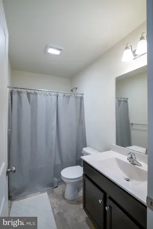 an aerial view of a house with a mountain