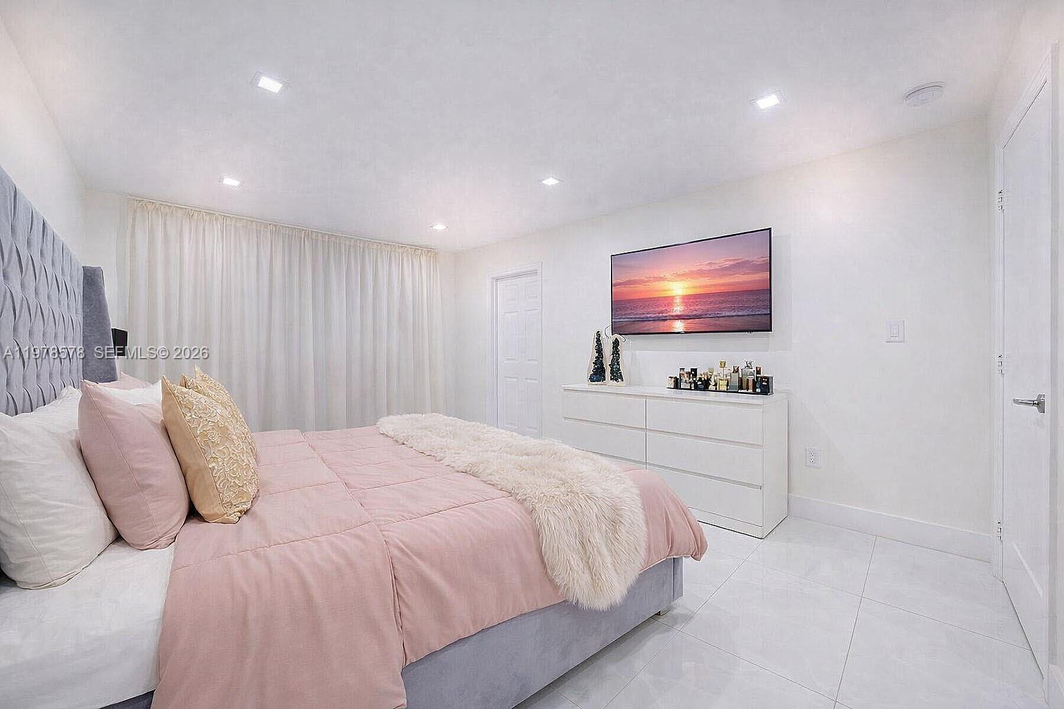 3502 Southwest 156th Court Miami, FL 33185 - Photo 11 of 47 a bedroom with a bed and a flat screen tv