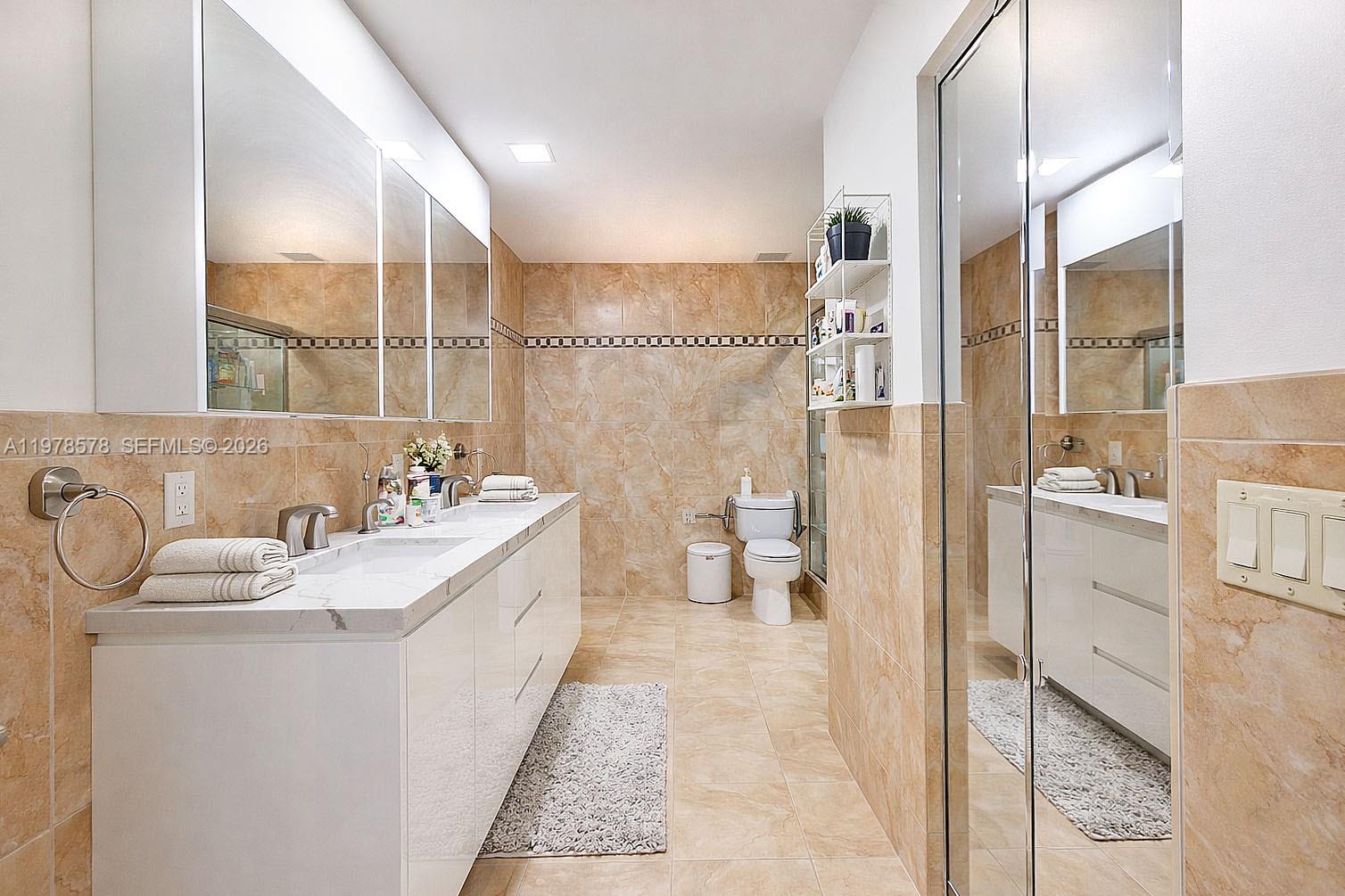 3502 Southwest 156th Court Miami, FL 33185 - Photo 16 of 47 a spacious bathroom with a sink a toilet and shower