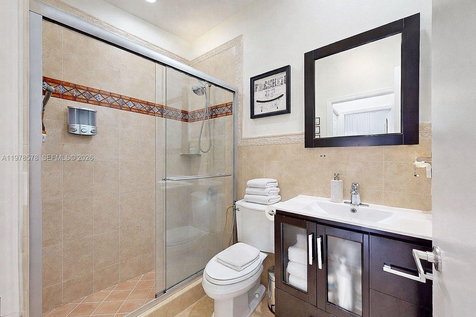 3502 Southwest 156th Court Miami, FL 33185 - Photo 17 of 47 a bathroom with a sink and a toilet