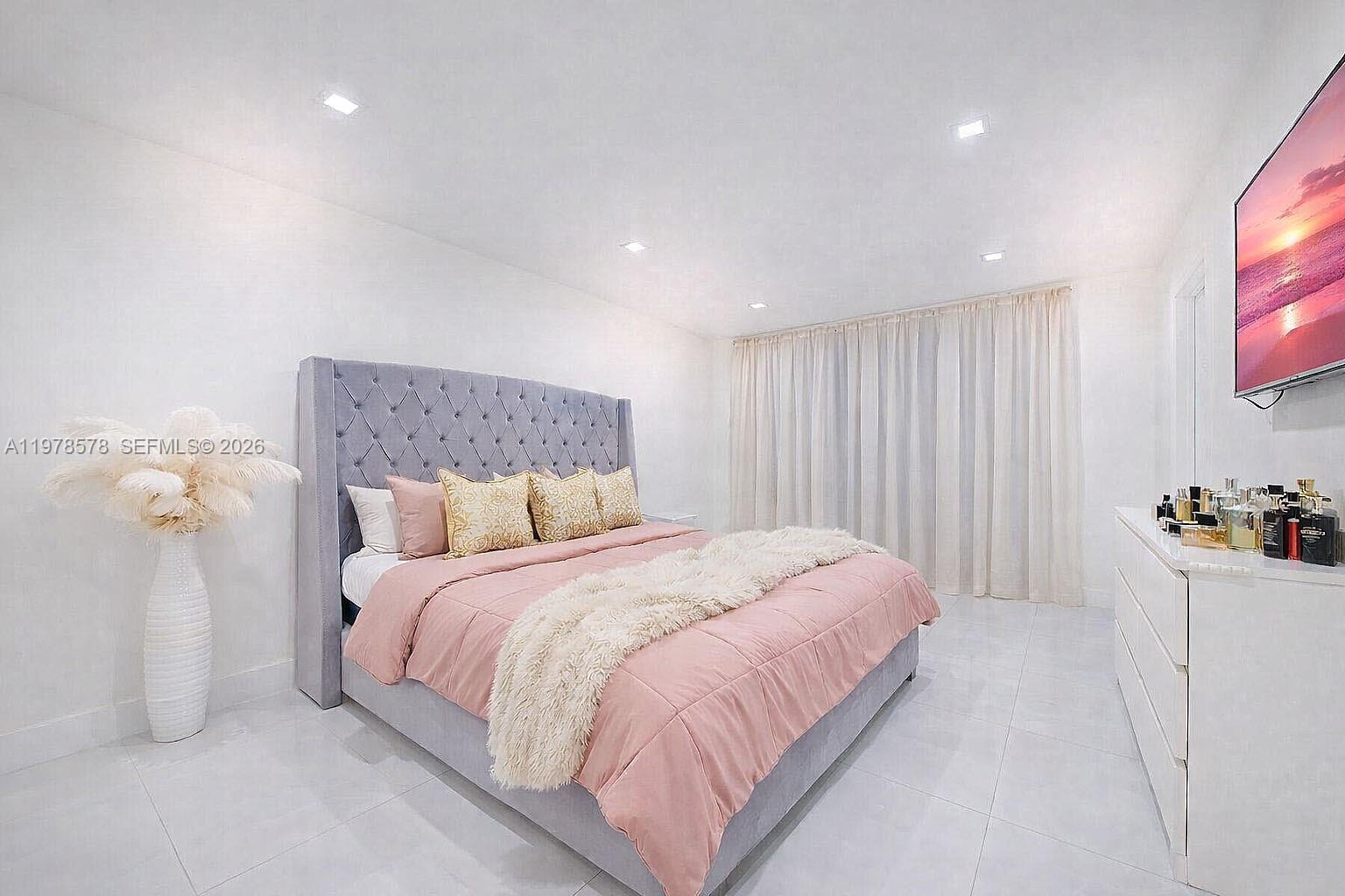 3502 Southwest 156th Court Miami, FL 33185 - Photo 28 of 47 a bedroom with a bed and a flat screen tv