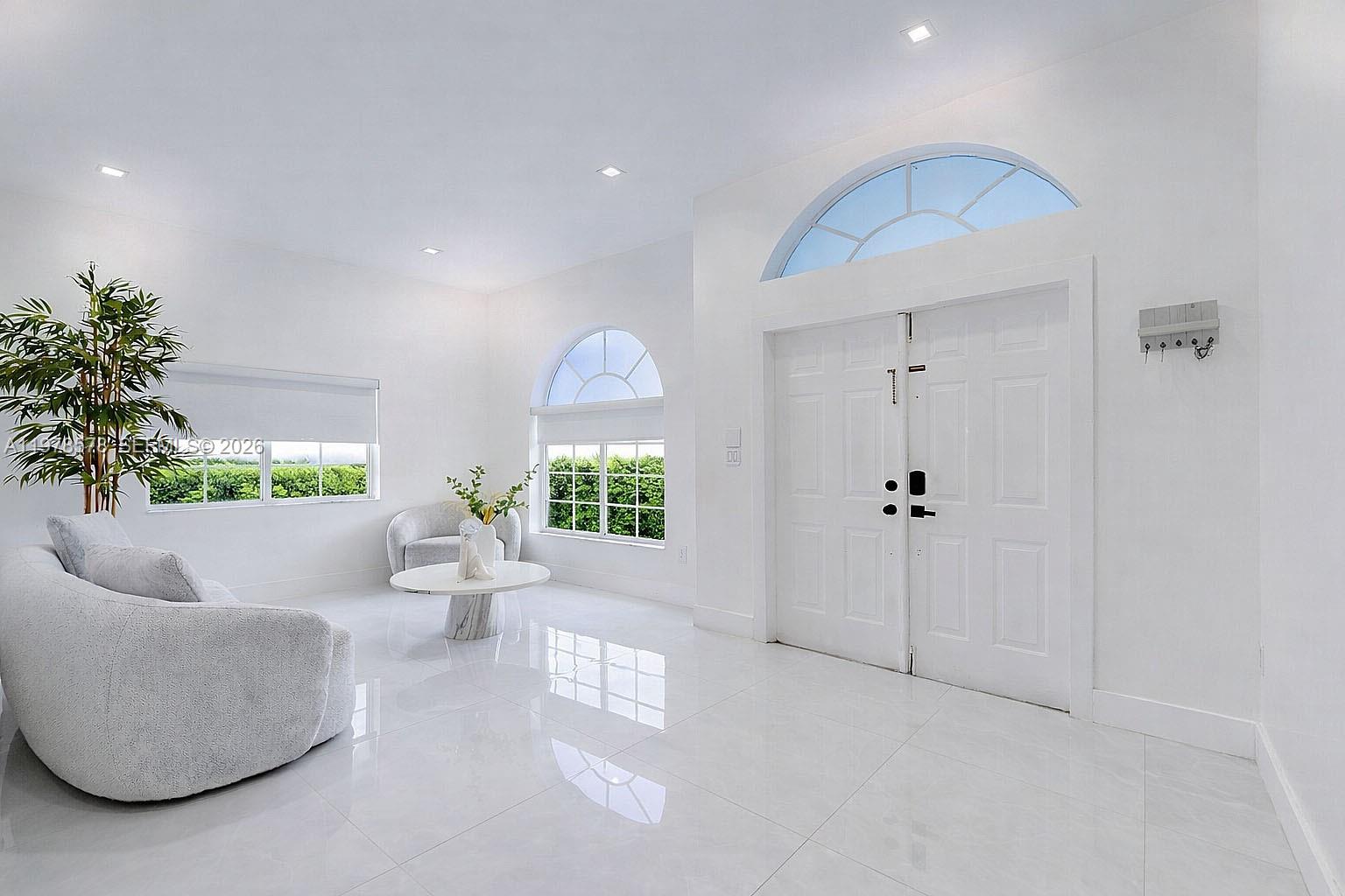 3502 Southwest 156th Court Miami, FL 33185 - Photo 31 of 47 a living room with furniture and a large window