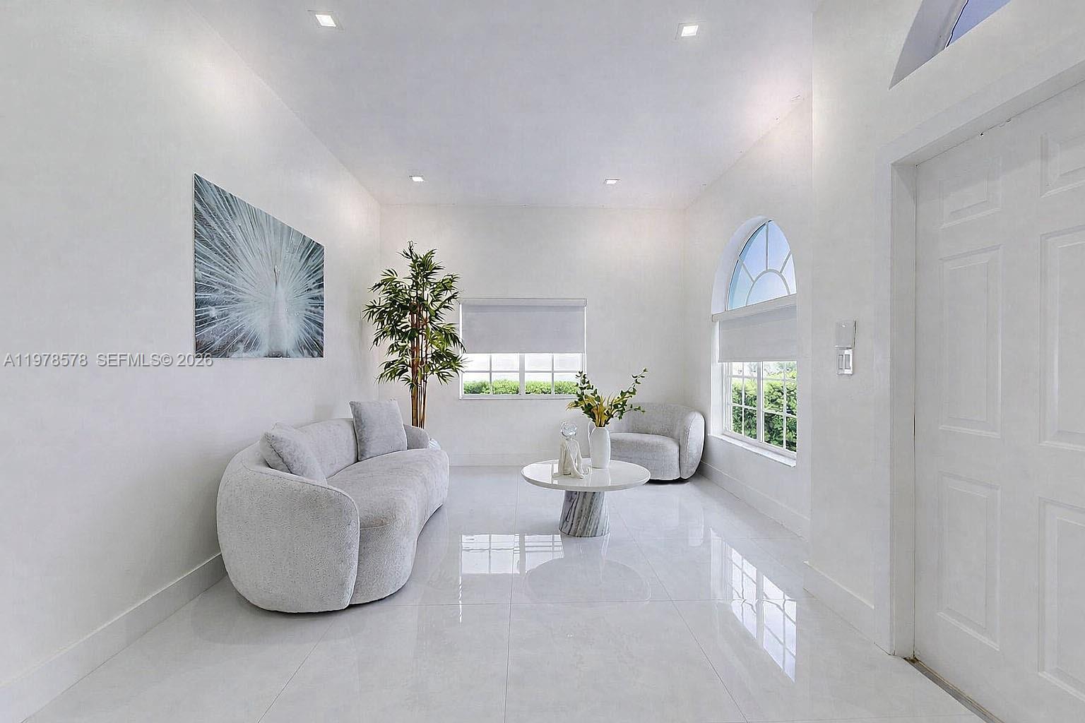 3502 Southwest 156th Court Miami, FL 33185 - Photo 32 of 47 a living room with furniture and a potted plant