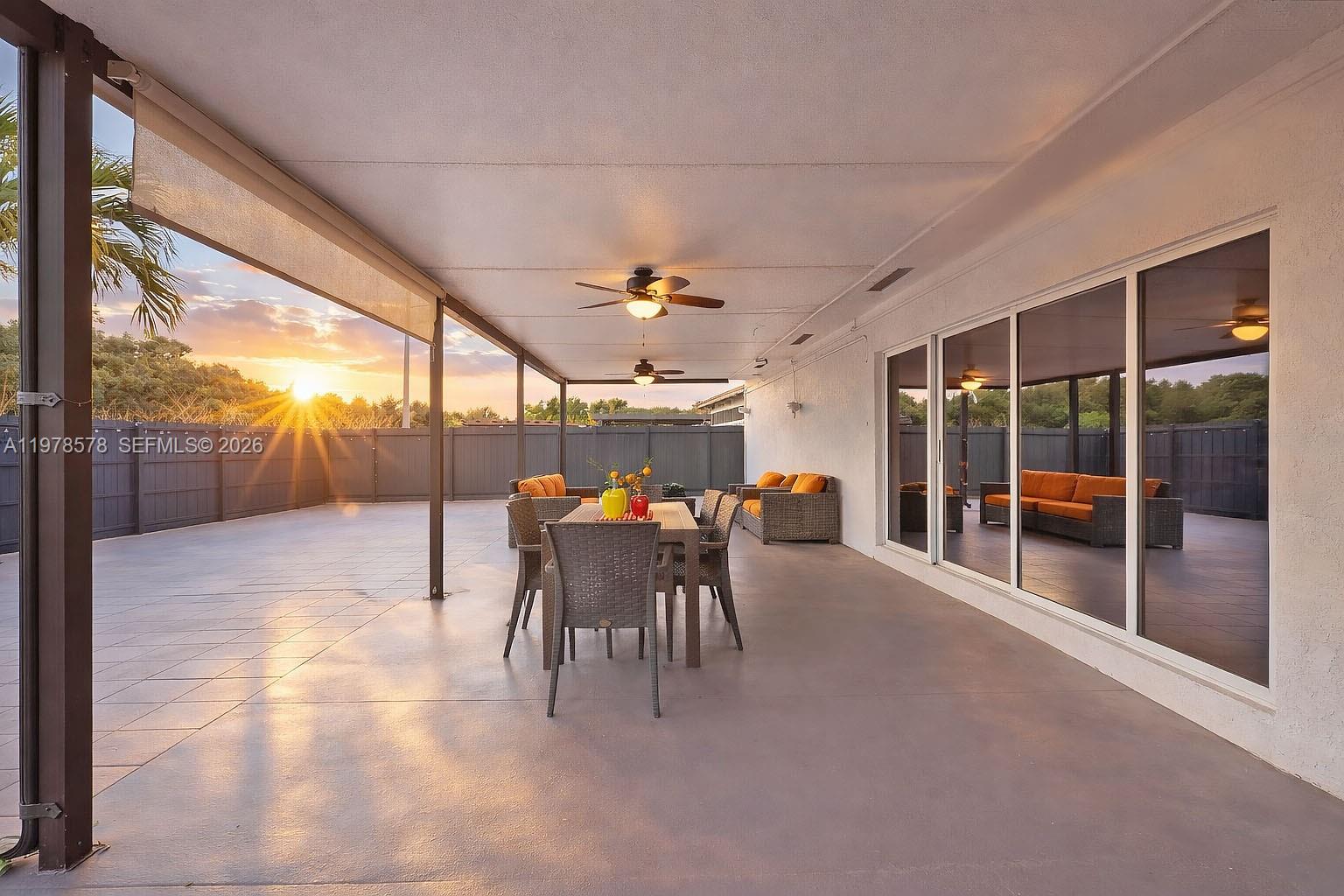 3502 Southwest 156th Court Miami, FL 33185 - Photo 35 of 47 a dining room with furniture and a garden view