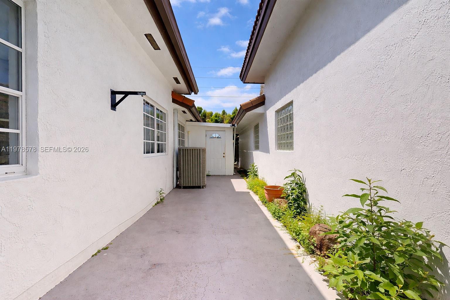 3502 Southwest 156th Court Miami, FL 33185 - Photo 36 of 47 a view of entryway and hall with wooden floor