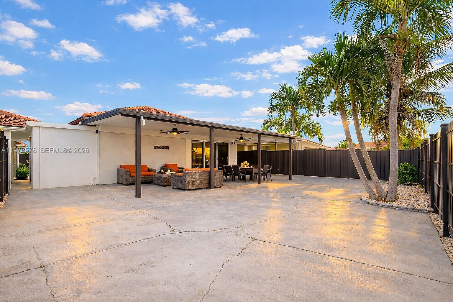 3502 Southwest 156th Court Miami, FL 33185 - Photo 37 of 47 a view of a white house with swimming pool and sitting area