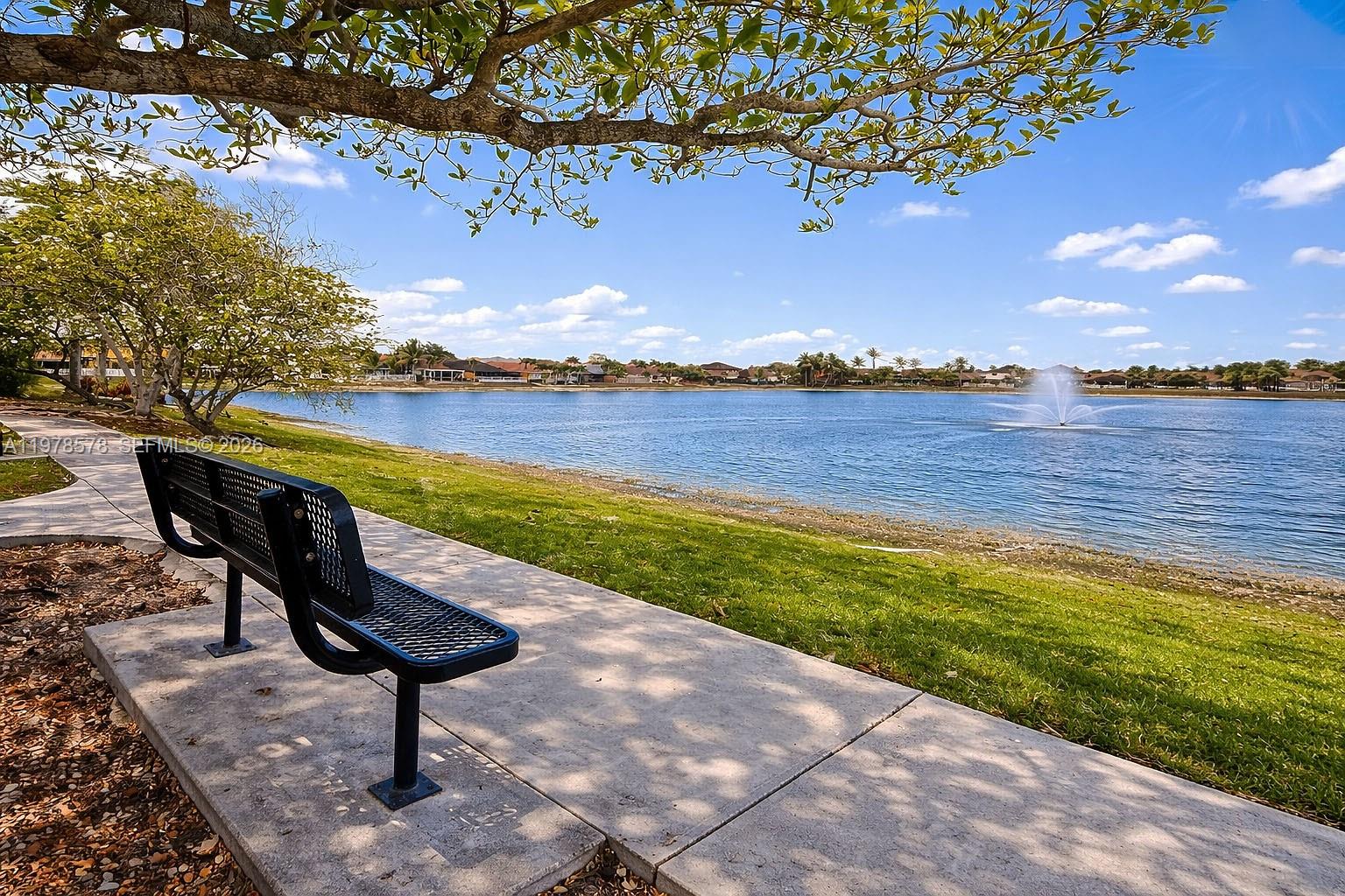 3502 Southwest 156th Court Miami, FL 33185 - Photo 42 of 47 a view of a lake with a table chairs