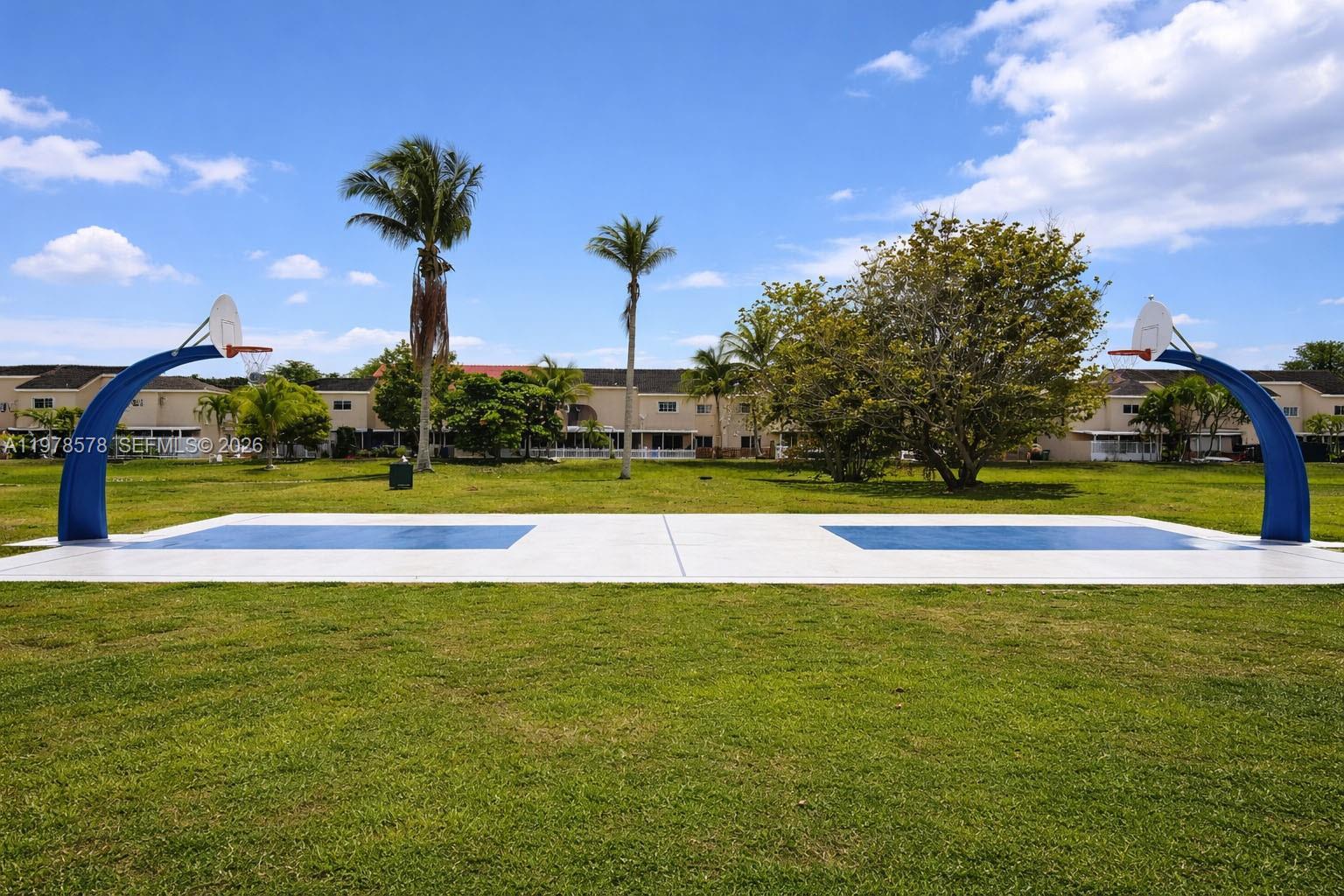 3502 Southwest 156th Court Miami, FL 33185 - Photo 43 of 47 a view of a swimming pool with an outdoor space and seating area