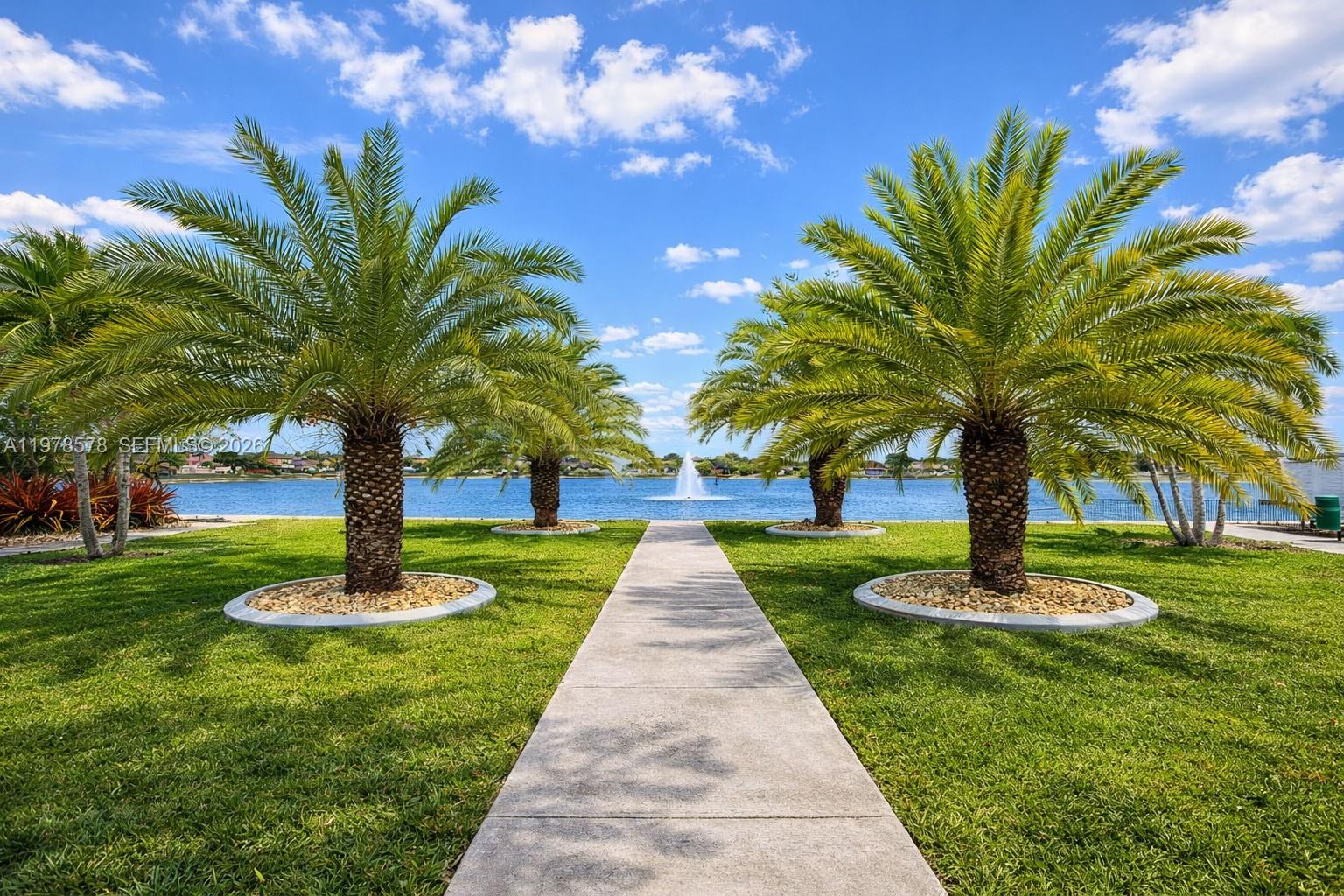 3502 Southwest 156th Court Miami, FL 33185 - Photo 45 of 47 a park with a bench and a large tree