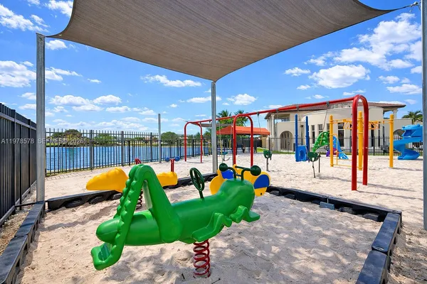 a view of a park with swings and slides