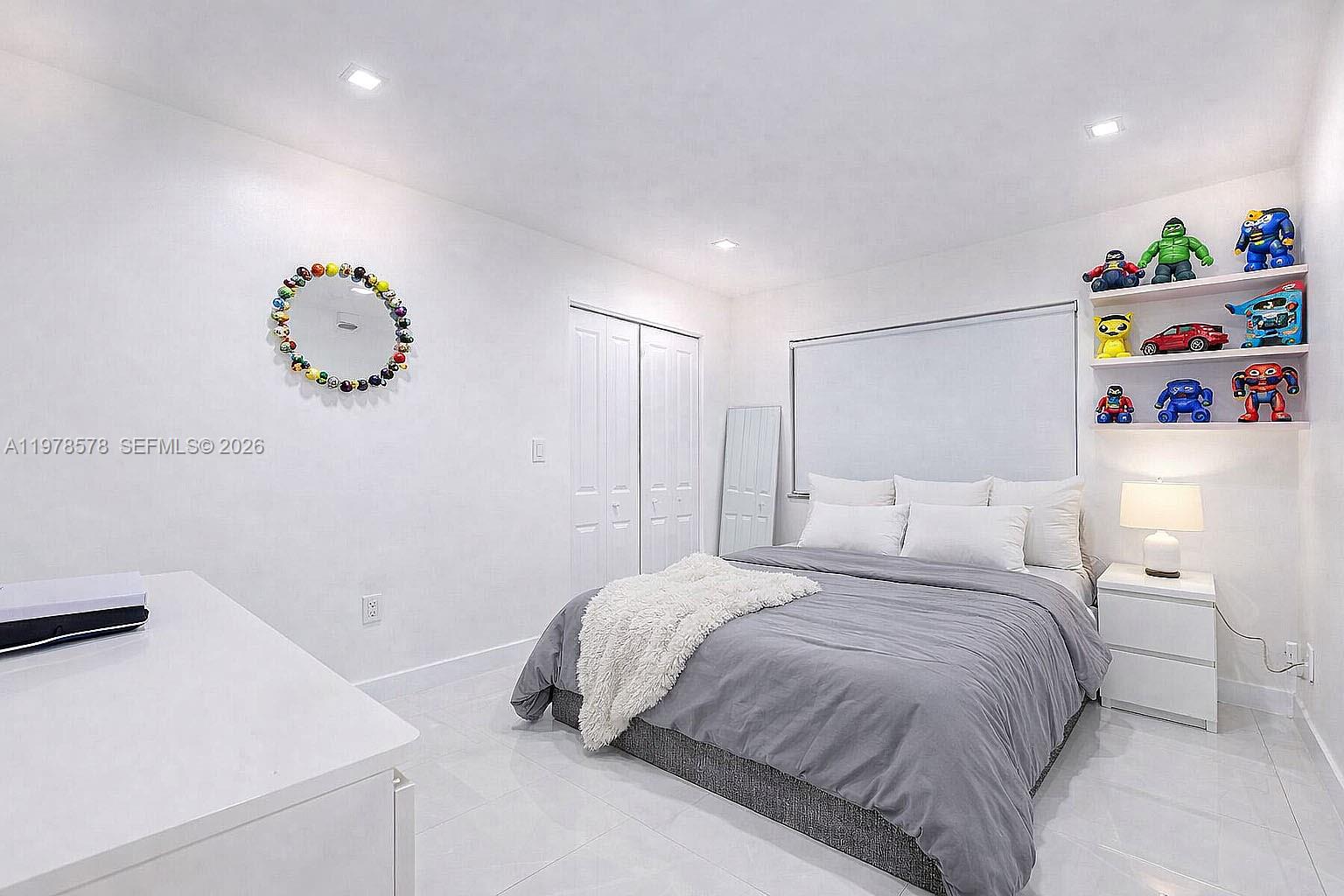 3502 Southwest 156th Court Miami, FL 33185 - Photo 10 of 47 a bedroom with a bed and a couch