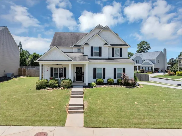 a front view of a house with a yard