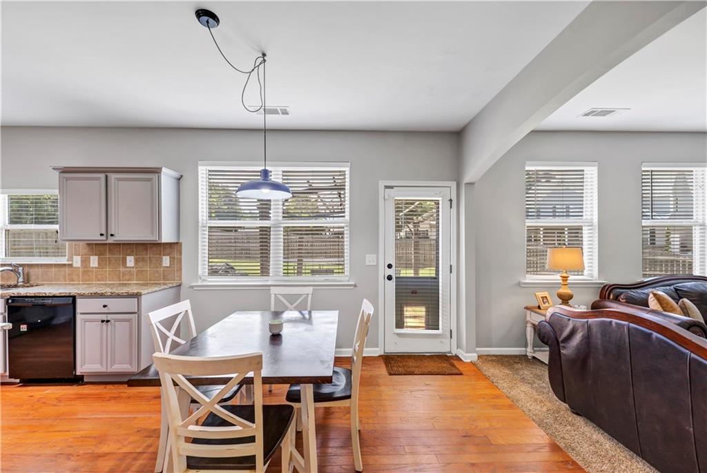 210 Creek View Lane Acworth, GA 30102 - Photo 17 of 48 a view of a dining room with furniture window and wooden floor