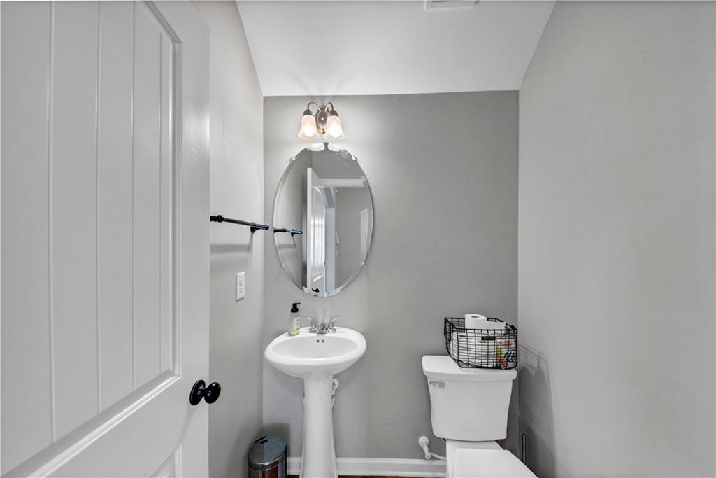 210 Creek View Lane Acworth, GA 30102 - Photo 18 of 48 a bathroom with a sink toilet and mirror
