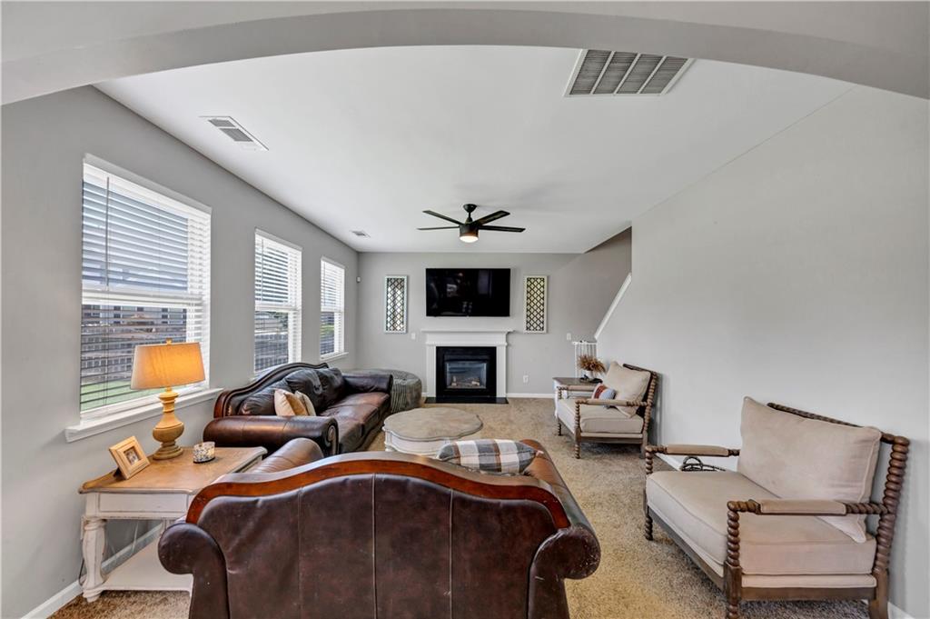210 Creek View Lane Acworth, GA 30102 - Photo 20 of 48 a living room with furniture fireplace and flat screen tv