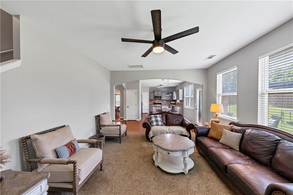 210 Creek View Lane Acworth, GA 30102 - Photo 22 of 48 a living room with furniture and a large window
