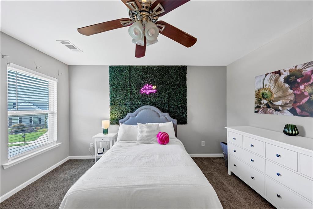 210 Creek View Lane Acworth, GA 30102 - Photo 29 of 48 a bedroom with a bed and a dresser