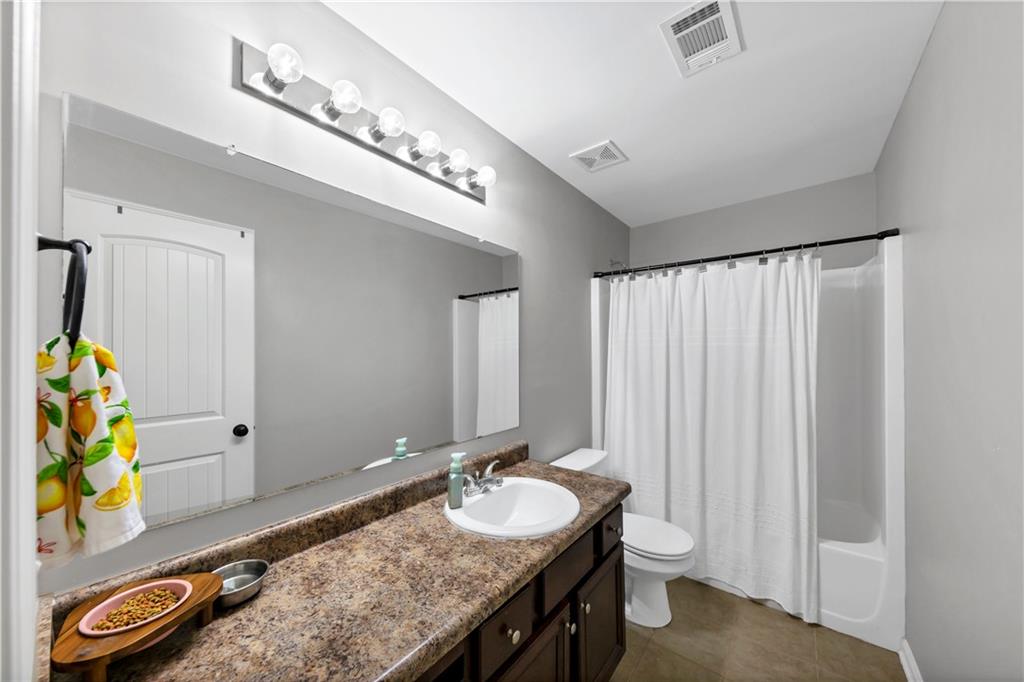 210 Creek View Lane Acworth, GA 30102 - Photo 31 of 48 a bathroom with a granite countertop sink and a mirror