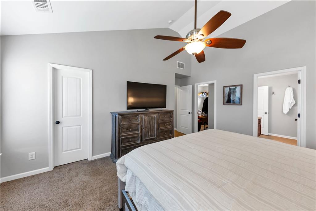 210 Creek View Lane Acworth, GA 30102 - Photo 34 of 48 a bedroom with a bed and a flat screen tv