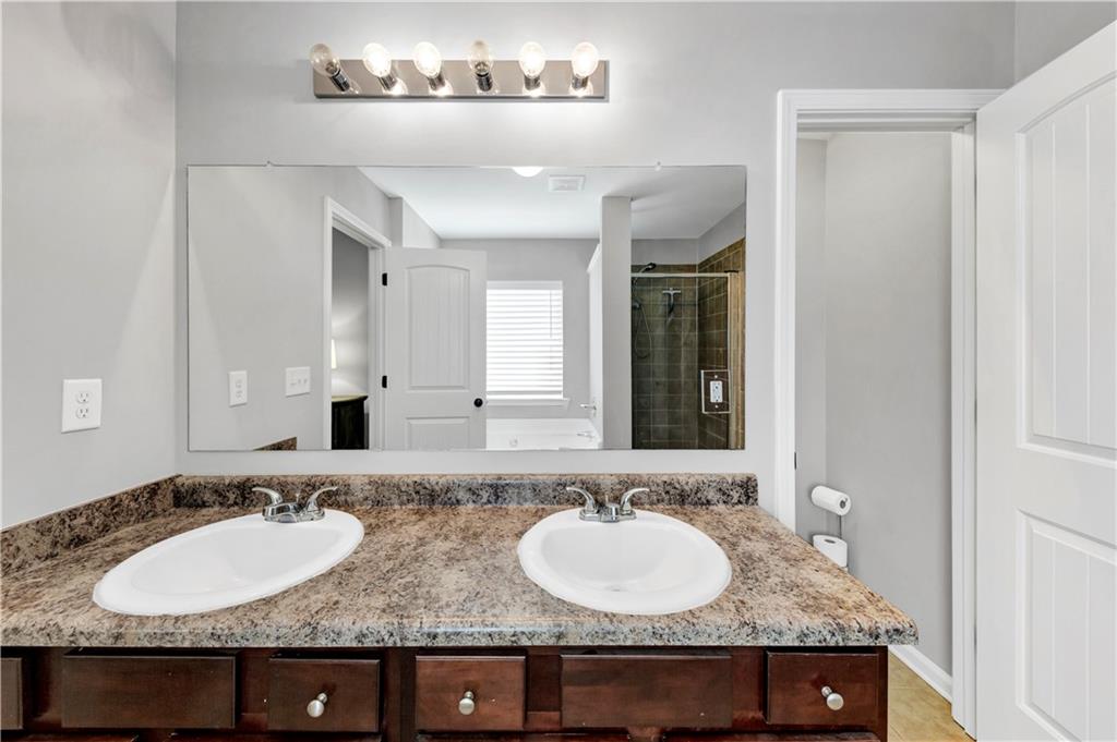 210 Creek View Lane Acworth, GA 30102 - Photo 36 of 48 a bathroom with a sink and a mirror