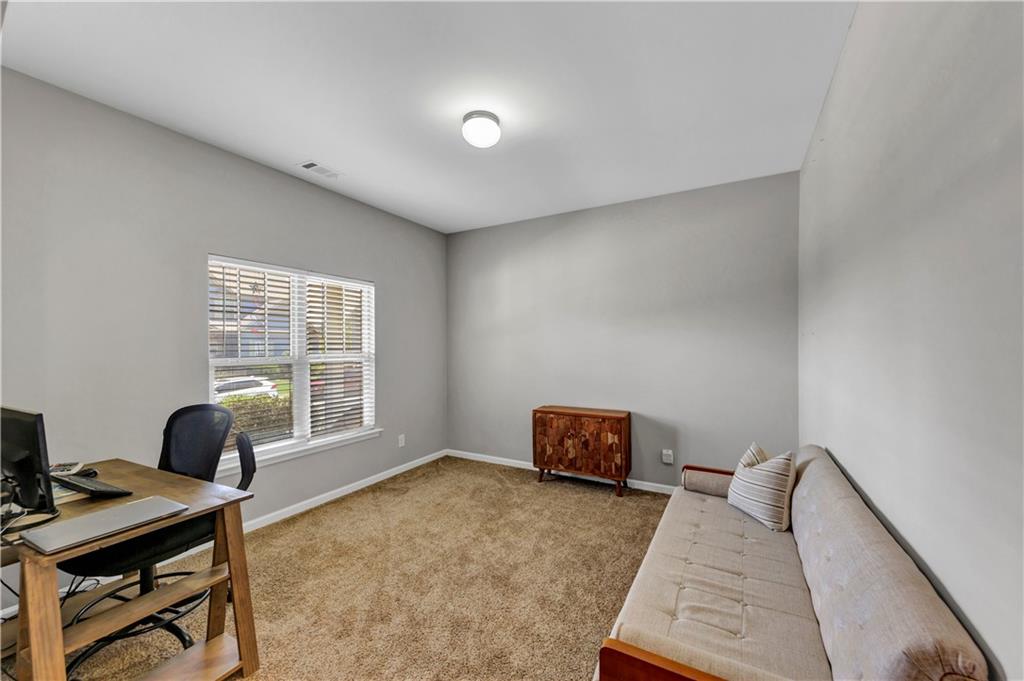 210 Creek View Lane Acworth, GA 30102 - Photo 6 of 48 a view of a workspace with furniture and a window