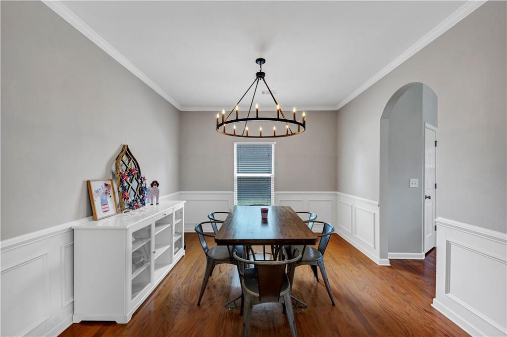 210 Creek View Lane Acworth, GA 30102 - Photo 8 of 48 a view of a dining room with furniture and wooden floor