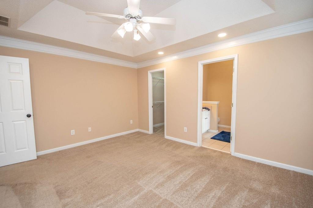 75 Bretts Bend Sharpsburg, GA 30277 - Photo 16 of 39 an empty room with a bathroom and a ceiling fan