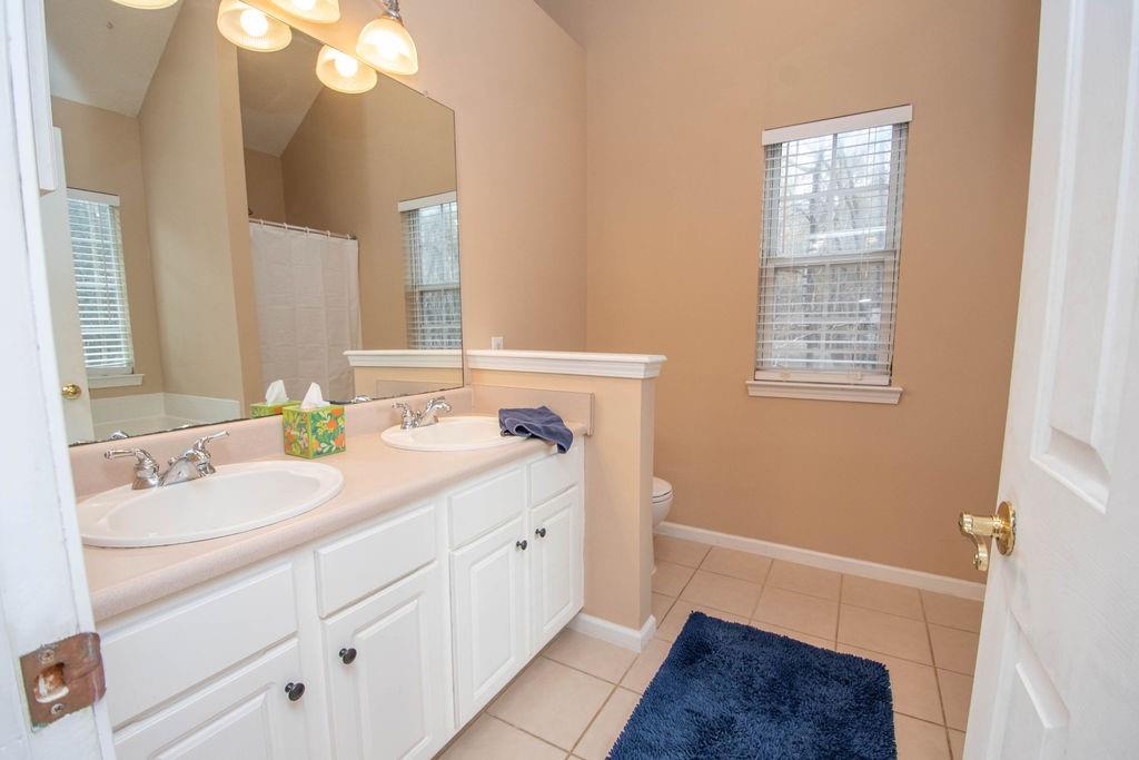 75 Bretts Bend Sharpsburg, GA 30277 - Photo 17 of 39 a bathroom with a sink a vanity and a mirror
