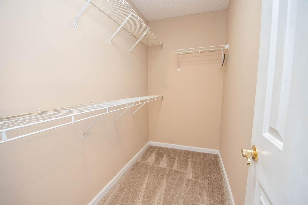 75 Bretts Bend Sharpsburg, GA 30277 - Photo 19 of 39 a view of a room with racks on the wall