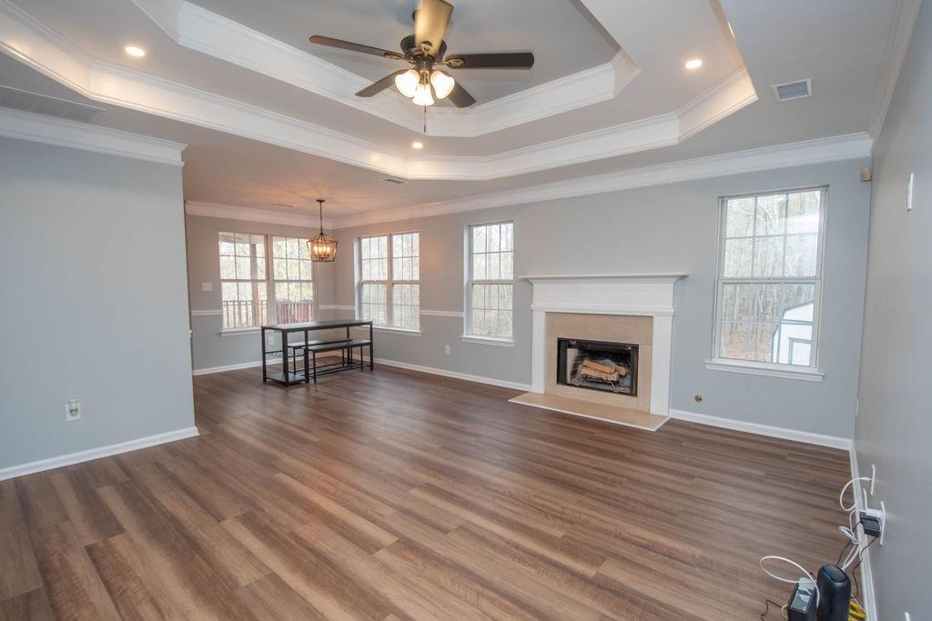 75 Bretts Bend Sharpsburg, GA 30277 - Photo 4 of 39 wooden floor fireplace and windows in an empty room