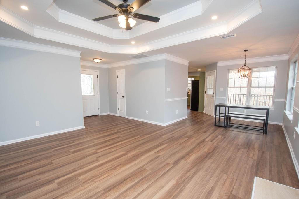 75 Bretts Bend Sharpsburg, GA 30277 - Photo 5 of 39 a view of empty room with wooden floor and fan