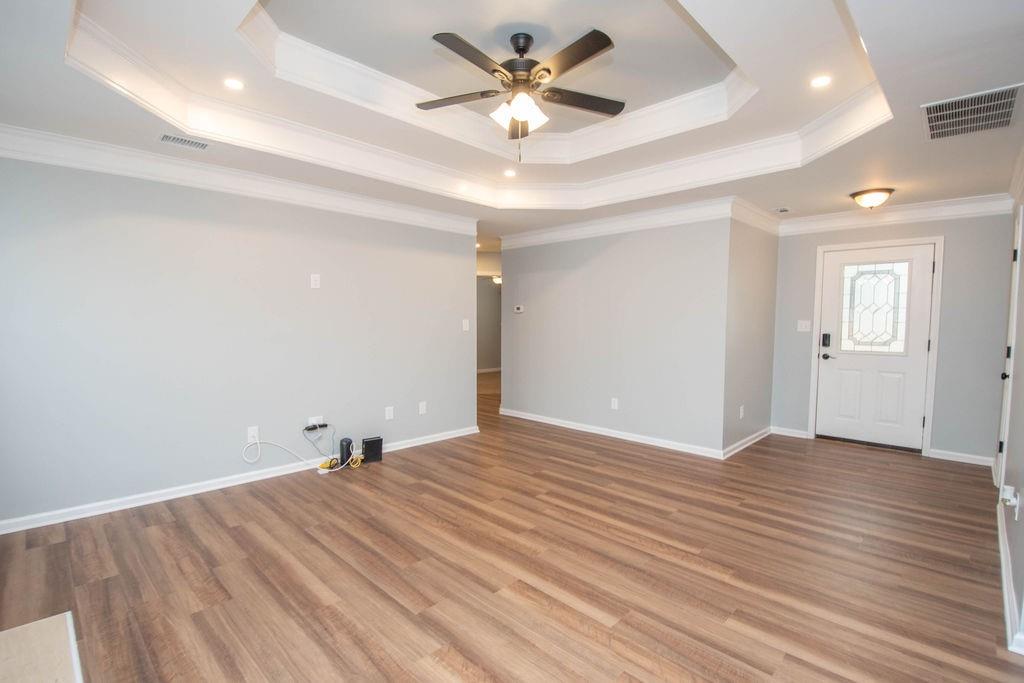 75 Bretts Bend Sharpsburg, GA 30277 - Photo 6 of 39 a view of an empty room and window a ceiling fan and wooden floor