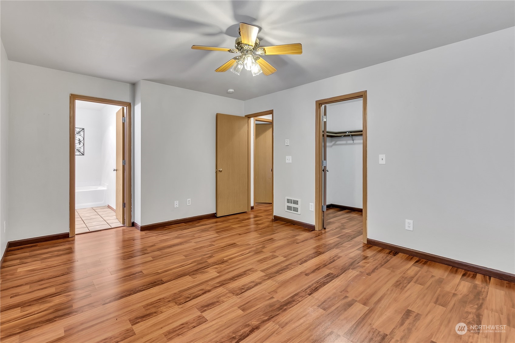 17545 Loop Lane Southeast Yelm, WA 98597 - Photo 18 of 35 wooden floor in an empty room with a window