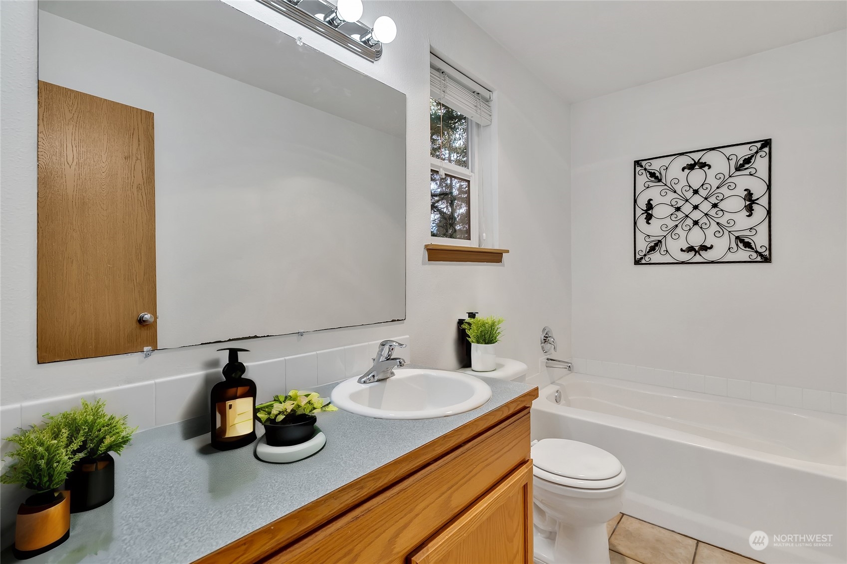 17545 Loop Lane Southeast Yelm, WA 98597 - Photo 19 of 35 a bathroom with a granite countertop sink a toilet and shower
